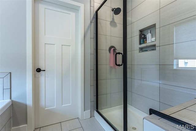 3841 Ember Ct, Edwardsville, IL 62025 - bathroom featuring a stall shower and tile patterned flooring
