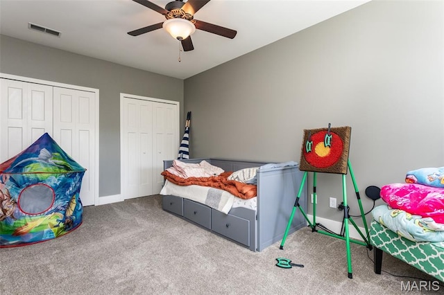 3841 Ember Ct, Edwardsville, IL 62025 - carpeted bedroom with two closets and ceiling fan