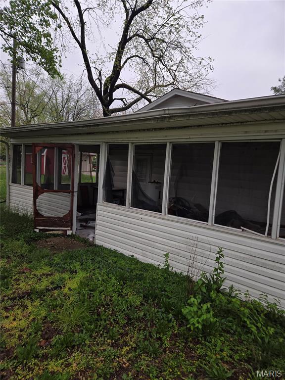 305 W 7th St, Cahokia, IL 62206 - view of side of property with a sunroom