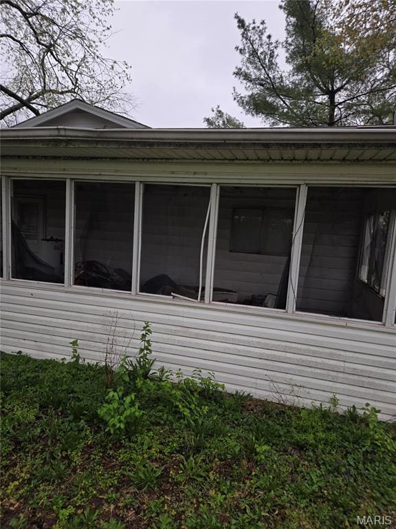 305 W 7th St, Cahokia, IL 62206 - view of property exterior with a sunroom