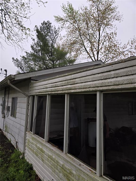 305 W 7th St, Cahokia, IL 62206 - view of side of home with a sunroom
