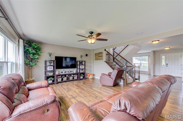 606 Wyndview Dr, Lake St Louis, MO 63367 - living area featuring stairs, wood finished floors, and a ceiling fan