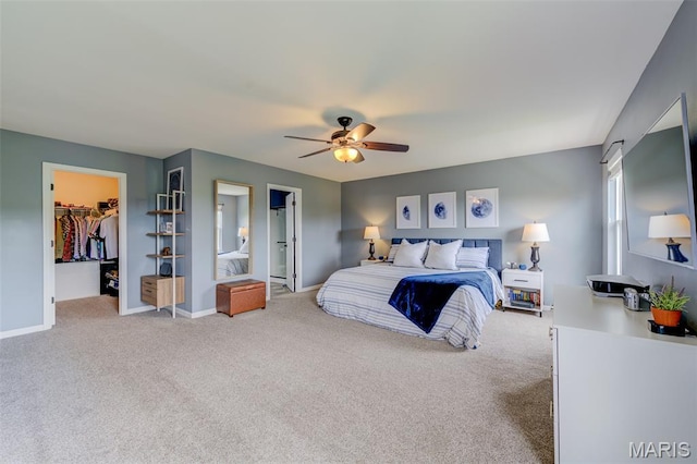 606 Wyndview Dr, Lake St Louis, MO 63367 - carpeted bedroom featuring a walk in closet, a ceiling fan, and a closet