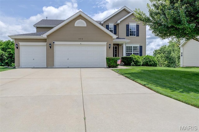 606 Wyndview Dr, Lake St Louis, MO 63367 - traditional home featuring a garage, concrete driveway, and a front lawn