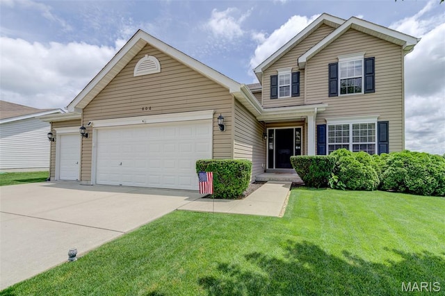 606 Wyndview Dr, Lake St Louis, MO 63367 - traditional-style house featuring an attached garage, concrete driveway, and a front lawn