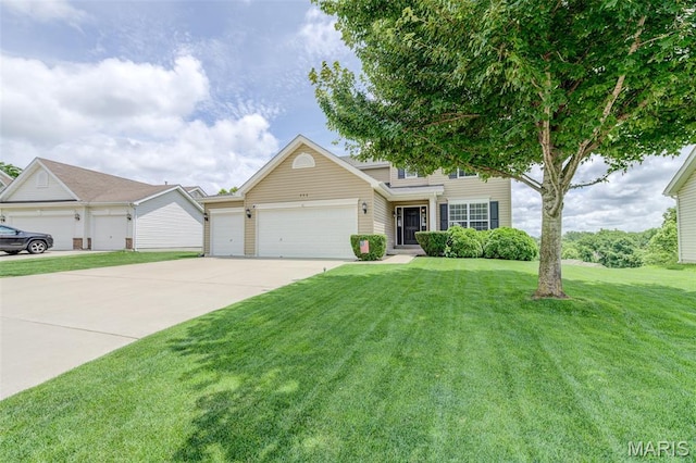 606 Wyndview Dr, Lake St Louis, MO 63367 - traditional-style home with concrete driveway, an attached garage, and a front yard
