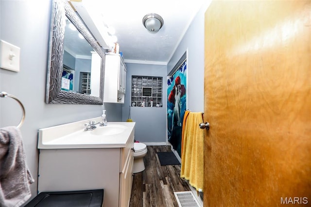 2909 Grand Ave, Granite City, IL 62040 - full bathroom featuring vanity, wood finished floors, and ornamental molding