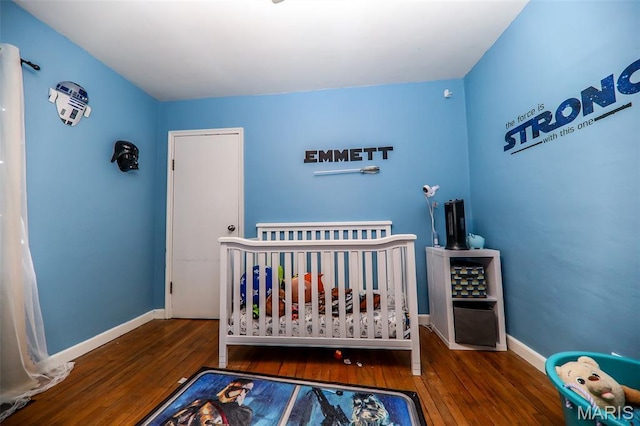 2909 Grand Ave, Granite City, IL 62040 - bedroom featuring hardwood / wood-style floors and a nursery area