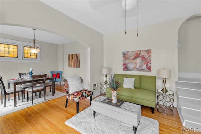 3119 Tamm Ave, Saint Louis, MO 63139 - living area featuring arched walkways and wood finished floors
