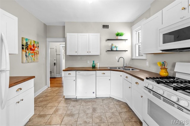 3119 Tamm Ave, Saint Louis, MO 63139 - kitchen with white appliances, wooden counters, white cabinetry, and open shelves