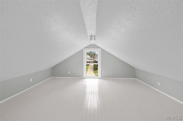 3119 Tamm Ave, Saint Louis, MO 63139 - bonus room with a textured ceiling, lofted ceiling, and wood finished floors