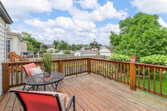 3119 Tamm Ave, Saint Louis, MO 63139 - wooden terrace with a fenced backyard, outdoor dining area, and a residential view