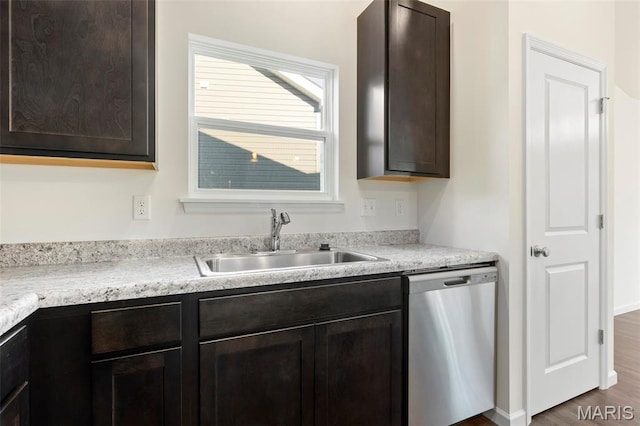4939 Knotty Alder Dr, Imperial, MO 63052 - kitchen with dishwasher, dark brown cabinetry, light countertops, and wood finished floors