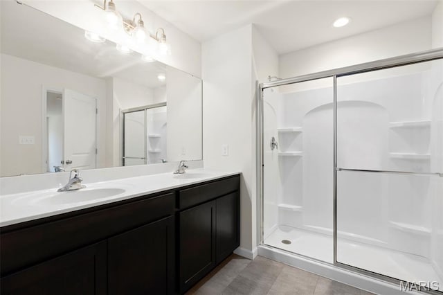 4939 Knotty Alder Dr, Imperial, MO 63052 - full bath with a stall shower, double vanity, and tile patterned flooring