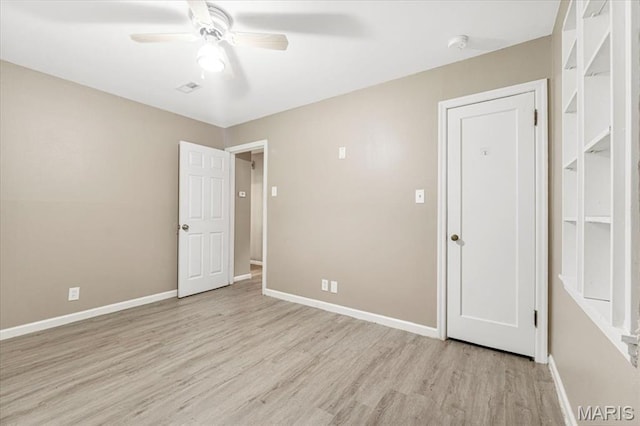 12 Mcnulty Dr, Florissant, MO 63031 - unfurnished bedroom featuring light wood-type flooring and ceiling fan