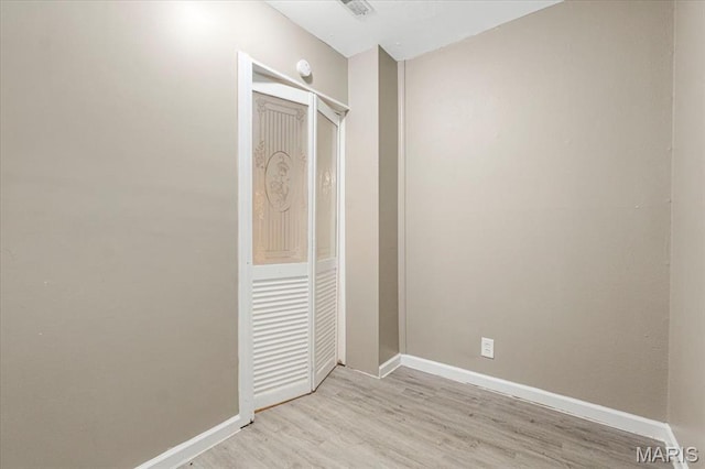 12 Mcnulty Dr, Florissant, MO 63031 - unfurnished bedroom featuring baseboards and light wood finished floors