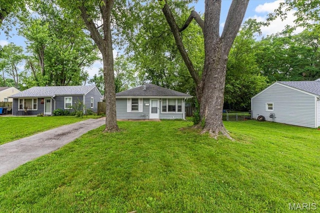 12 Mcnulty Dr, Florissant, MO 63031 - view of front of house featuring asphalt driveway