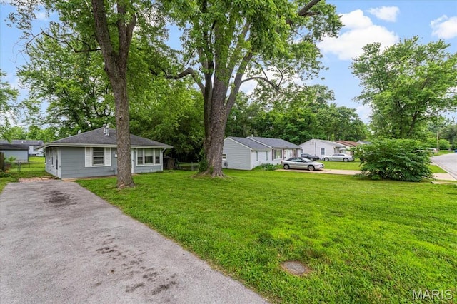 12 Mcnulty Dr, Florissant, MO 63031 - view of green lawn with driveway