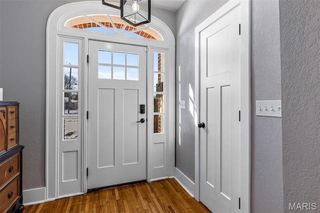 402 S Walker St, Montgomery City, MO 63361 - foyer entrance featuring dark wood-style floors and a textured wall