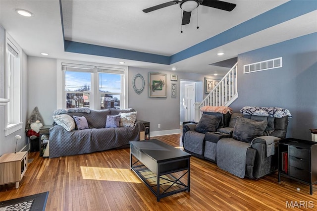 402 S Walker St, Montgomery City, MO 63361 - living room with hardwood / wood-style flooring, ceiling fan, stairway, a tray ceiling, and recessed lighting