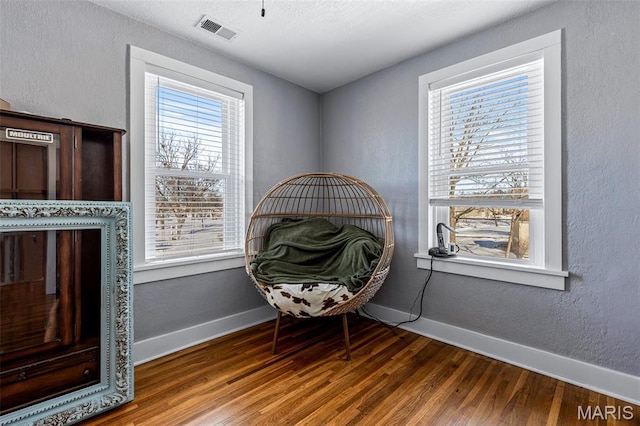 402 S Walker St, Montgomery City, MO 63361 - sitting room with plenty of natural light and wood finished floors
