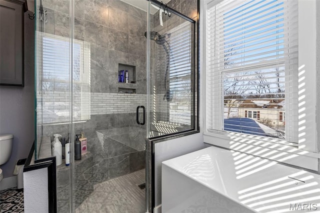 402 S Walker St, Montgomery City, MO 63361 - full bathroom with a freestanding bath, healthy amount of natural light, and a shower stall