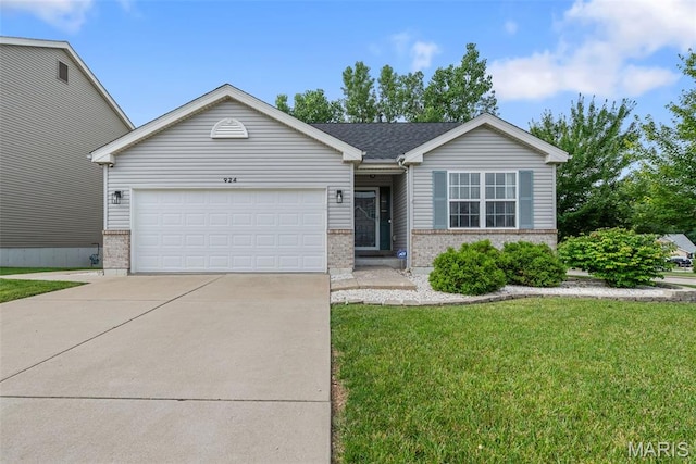 924 Tower Pl, Ofallon, MO 63366 - ranch-style home featuring brick siding, an attached garage, driveway, and a front lawn