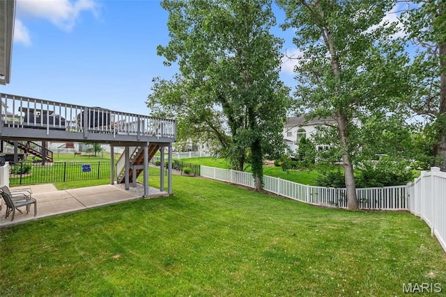 924 Tower Pl, Ofallon, MO 63366 - fenced backyard with stairway, a patio area, and a wooden deck