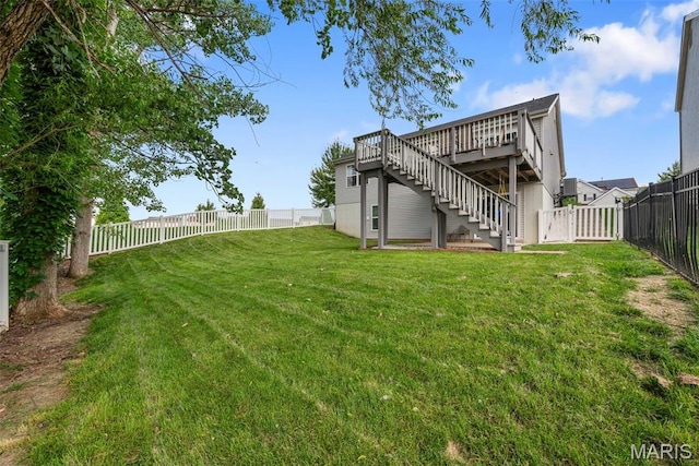 924 Tower Pl, Ofallon, MO 63366 - fenced backyard with stairs and a wooden deck