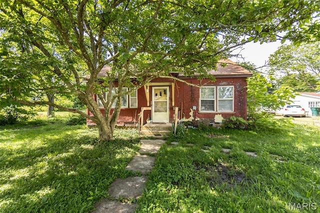 129 Maple Ave, Licking, MO 65542 - obstructed view of property with a front yard