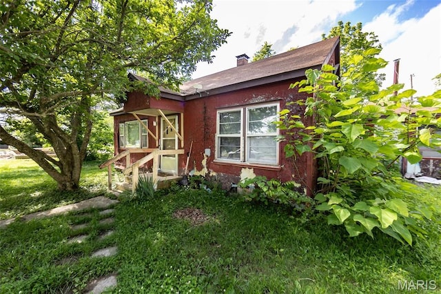 129 Maple Ave, Licking, MO 65542 - bungalow featuring a chimney