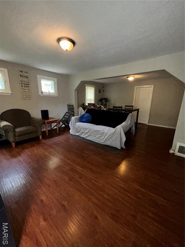 7155 Theodore Ave, Jennings, MO 63136 - bedroom featuring wood finished floors and a textured ceiling