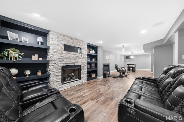 80 Brookshire Creek Dr, Wentzville, MO 63385 - living area with wood finished floors, a fireplace, recessed lighting, and built in shelves