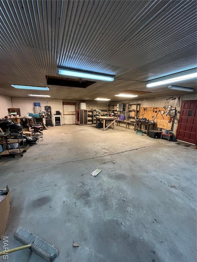 1004 W Taylor St, Bowling Green, MO 63334 - miscellaneous room featuring unfinished concrete flooring and a garage