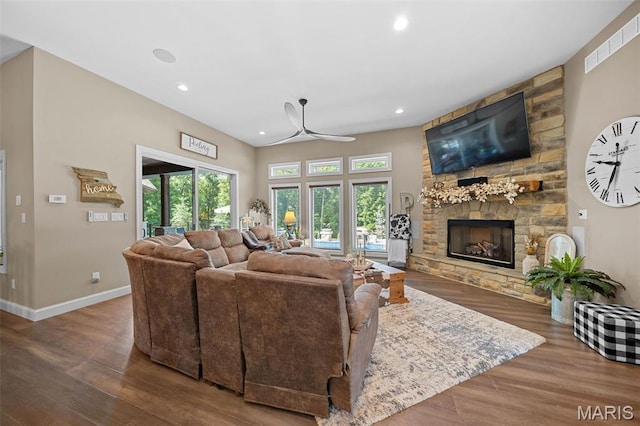 32 Taylors Way, Foristell, MO 63348 - living room with wood finished floors, ceiling fan, a stone fireplace, and recessed lighting