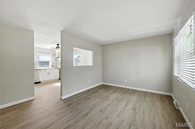 4681 Hillsboro House Springs Rd, House Springs, MO 63051 - empty room with healthy amount of natural light, light wood finished floors, and ceiling fan