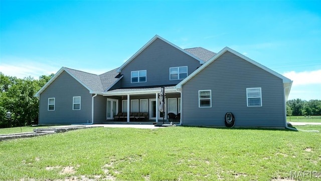 3215 Timber Ridge Rd, Palmyra, MO 63461 - rear view of house with a lawn and a patio area