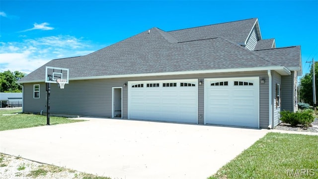 3215 Timber Ridge Rd, Palmyra, MO 63461 - view of property exterior with a garage, driveway, and a shingled roof