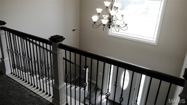 3215 Timber Ridge Rd, Palmyra, MO 63461 - stairway featuring a chandelier and carpet floors