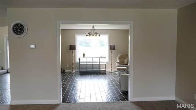 3215 Timber Ridge Rd, Palmyra, MO 63461 - entryway with baseboards and a chandelier