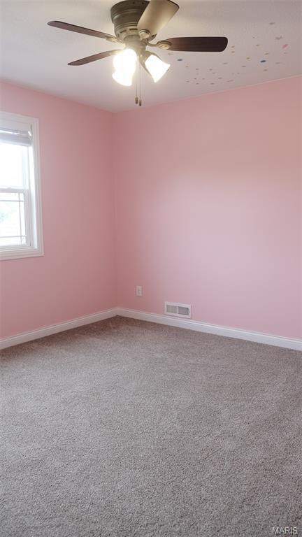3215 Timber Ridge Rd, Palmyra, MO 63461 - carpeted empty room with a ceiling fan and baseboards