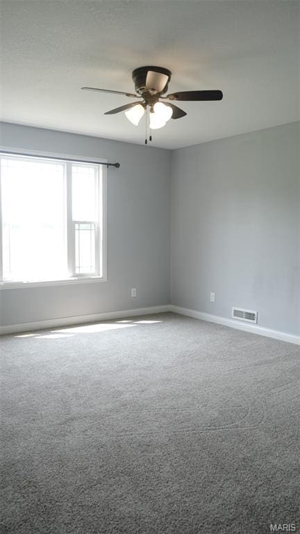 3215 Timber Ridge Rd, Palmyra, MO 63461 - carpeted spare room featuring a ceiling fan and baseboards
