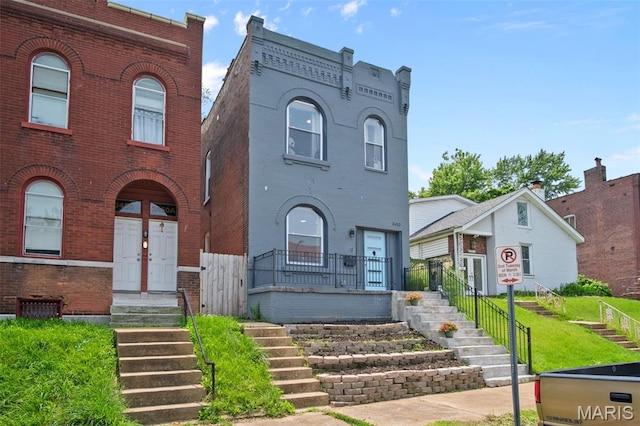 3452 Osage St, Saint Louis, MO 63118 - townhome / multi-family property featuring brick siding
