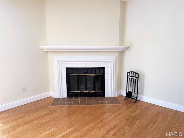 1418 Bluebird Ter, Saint Louis, MO 63144 - detailed view of wood finished floors and a tile fireplace