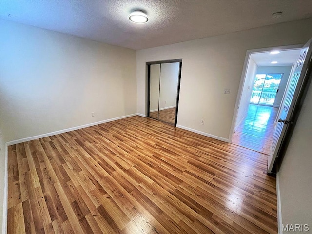 1418 Bluebird Ter, Saint Louis, MO 63144 - unfurnished room with light wood-type flooring, a smoke detector, and a textured ceiling