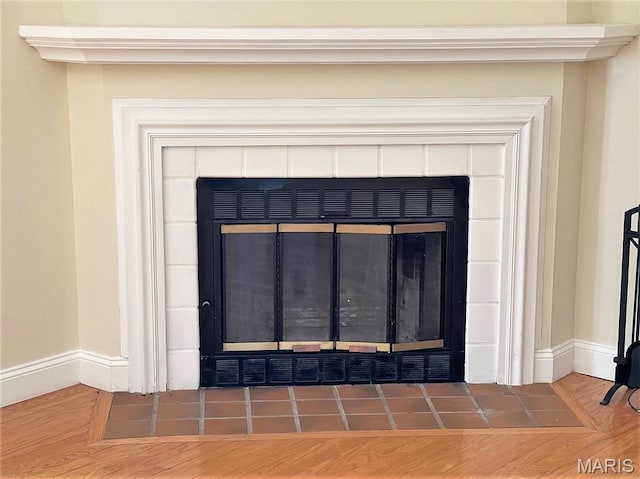 1418 Bluebird Ter, Saint Louis, MO 63144 - detailed view of a fireplace and wood finished floors