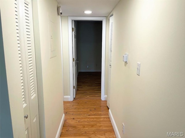 1418 Bluebird Ter, Saint Louis, MO 63144 - corridor featuring light wood finished floors and baseboards