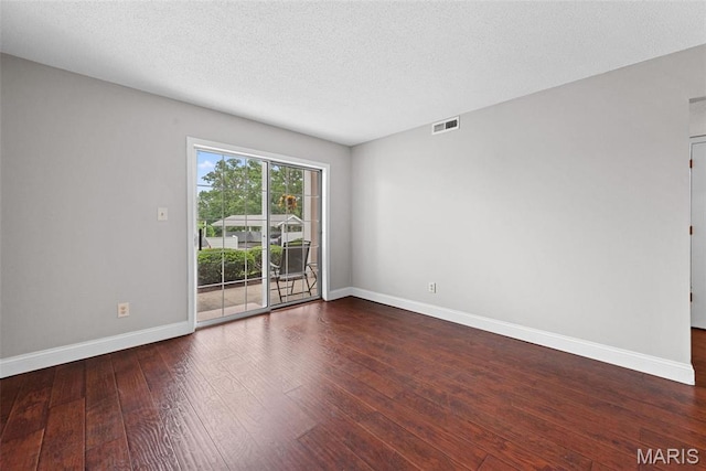 2 Berview Cir Unit H, Saint Louis, MO 63129 - unfurnished room with wood-type flooring and a textured ceiling