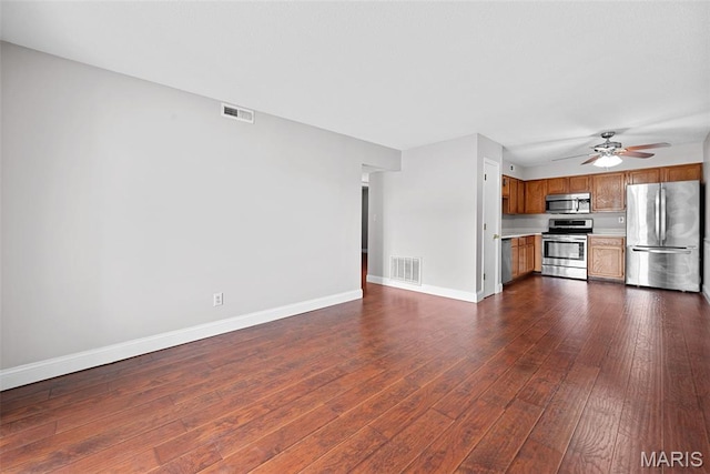 2 Berview Cir Unit H, Saint Louis, MO 63129 - unfurnished living room featuring dark wood finished floors and a ceiling fan
