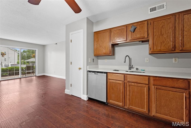 2 Berview Cir Unit H, Saint Louis, MO 63129 - kitchen featuring stainless steel dishwasher, brown cabinets, a ceiling fan, light countertops, and dark wood-style floors